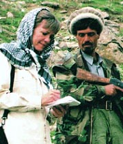 photo of Dana Priest interviewing an Afghan farmer