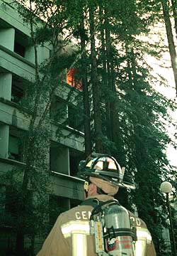 Photo of fireman watching blaze