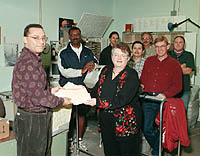 Photo of Chancellor Greenwood and Mail Services staff with donations