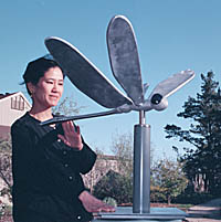 Photo: Nobuho Nagasawa by an art piece